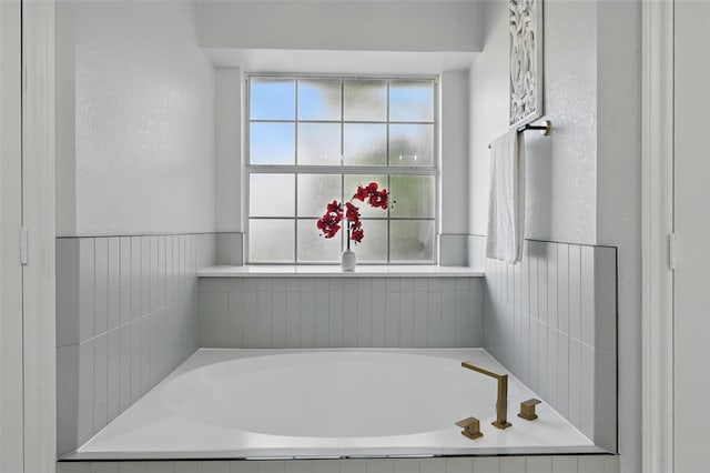 full bath featuring a bath