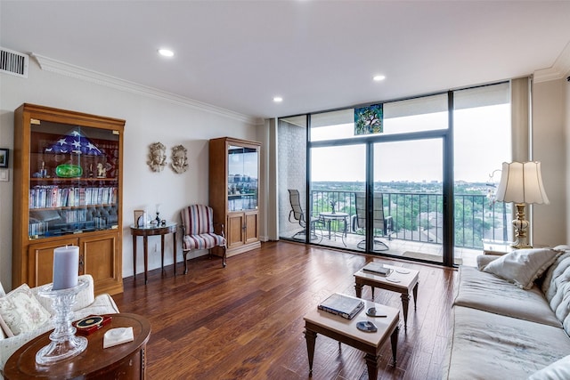 living area featuring a wall of windows, crown molding, wood finished floors, and recessed lighting