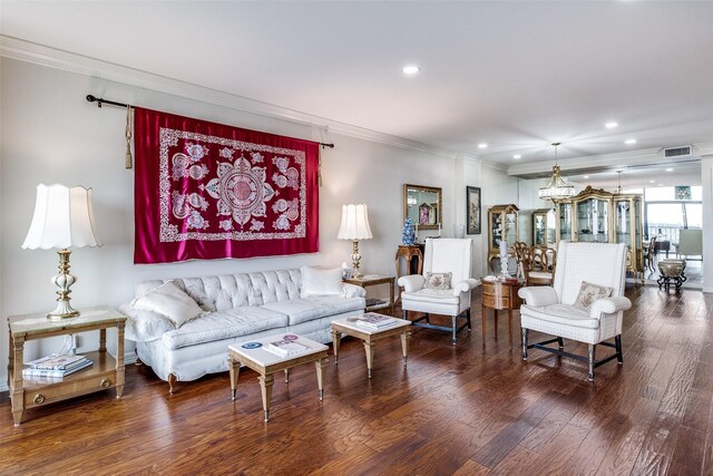 living area with crown molding, wood finished floors, and recessed lighting