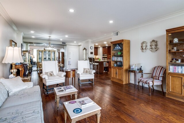 living room featuring ornamental molding, recessed lighting, dark wood-style flooring, and a chandelier