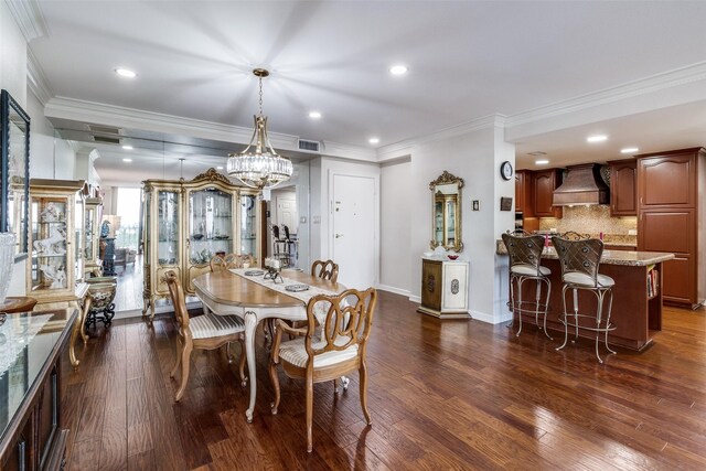 dining space featuring a chandelier, ornamental molding, dark wood-style flooring, recessed lighting, and baseboards