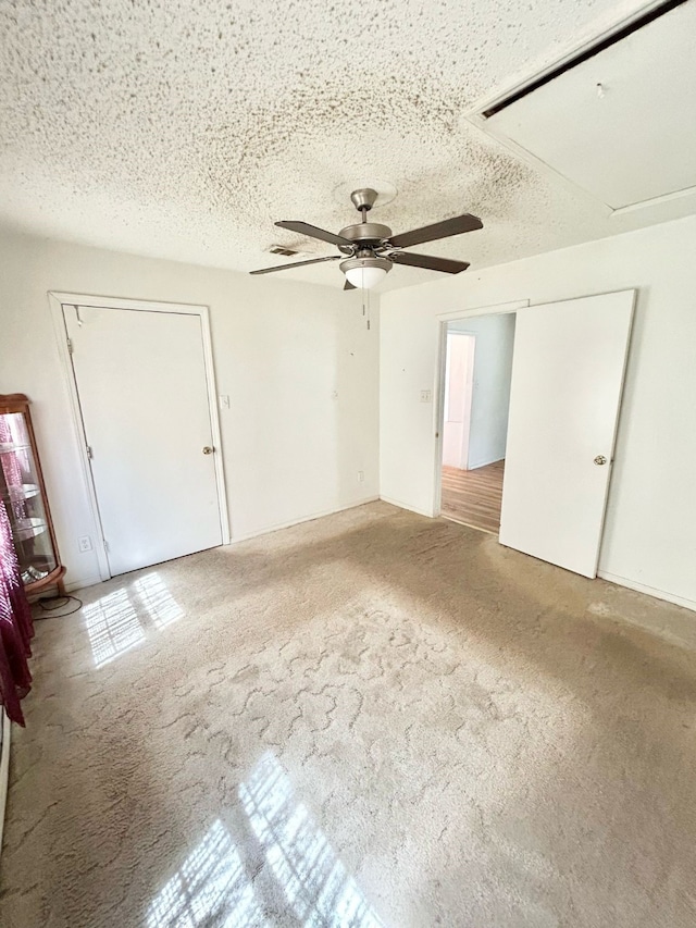 3601 Avenue N, Fort Worth, TX 76105 - unfurnished room featuring a ceiling fan, carpet, and a textured ceiling