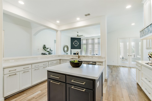 2406 Capitol Pl, Melissa, TX 75454 - kitchen with a sink, white cabinetry, light countertops, and recessed lighting