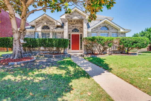 1361 Daffodil Ln, Lewisville, TX 75077 - view of front of home featuring a front yard and brick siding