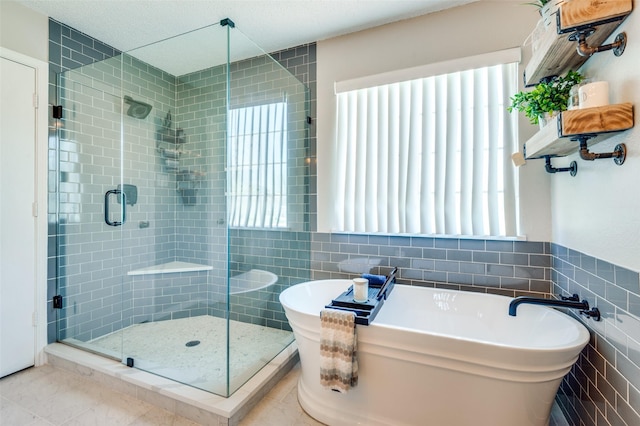 1361 Daffodil Ln, Lewisville, TX 75077 - full bath featuring tile walls, a stall shower, and a freestanding bath