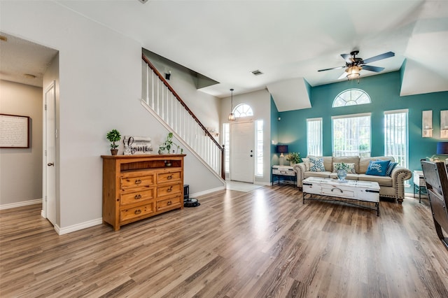 1361 Daffodil Ln, Lewisville, TX 75077 - living room with stairs, baseboards, wood finished floors, and ceiling fan
