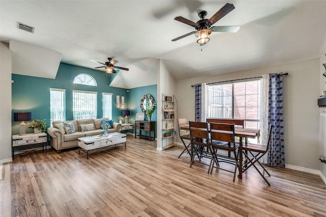 1361 Daffodil Ln, Lewisville, TX 75077 - living room featuring ceiling fan, light wood-type flooring, baseboards, and vaulted ceiling