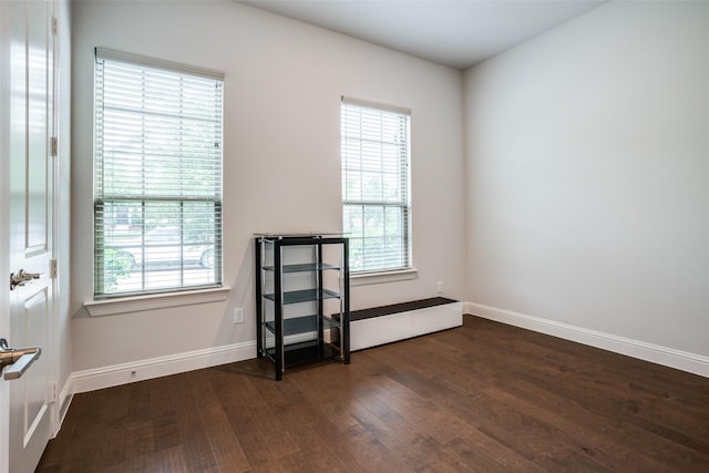 1043 Sarah St, Allen, TX 75013 - spare room featuring wood finished floors, plenty of natural light, and baseboards