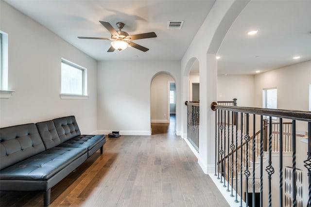 1043 Sarah St, Allen, TX 75013 - hall featuring plenty of natural light, hardwood / wood-style floors, arched walkways, baseboards, and recessed lighting