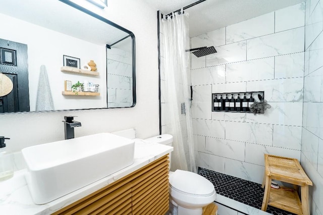 9471 Twin Creeks Cir, Anna, TX 75409 - bathroom with tiled shower, toilet, and vanity