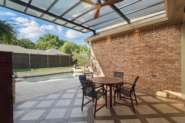 view of patio / terrace featuring fence, a pergola, and outdoor dining area