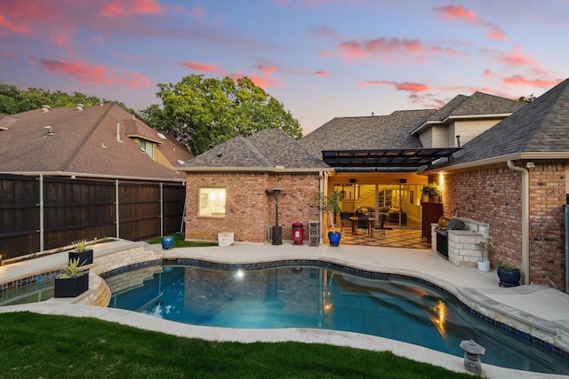 view of swimming pool with a fenced backyard, a patio area, and a pergola