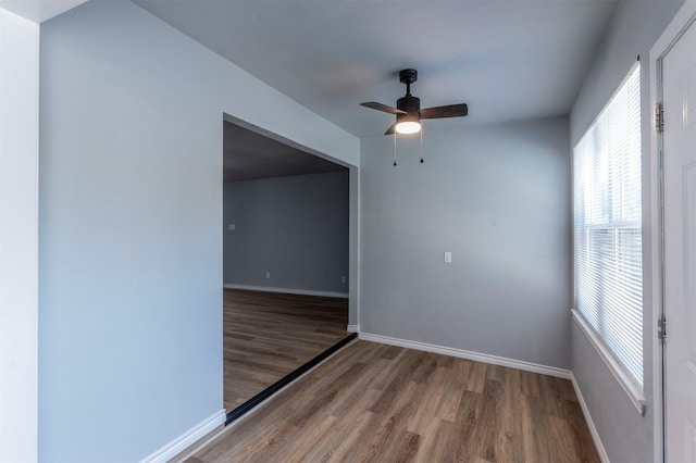 8721 N Normandale St, Fort Worth, TX 76116 - empty room featuring wood finished floors, plenty of natural light, a ceiling fan, and baseboards