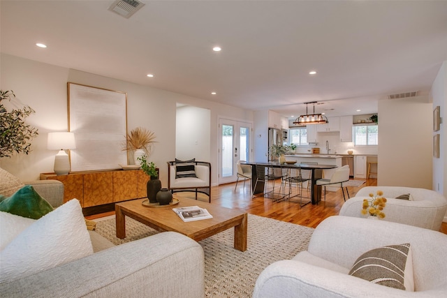 1205 Ranier St, Dallas, TX 75208 - living area featuring light wood-style floors and recessed lighting