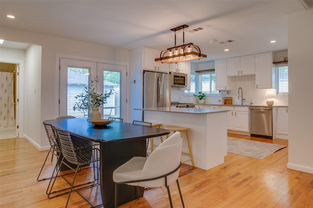 1205 Ranier St, Dallas, TX 75208 - dining space featuring light wood-style flooring, recessed lighting, and baseboards