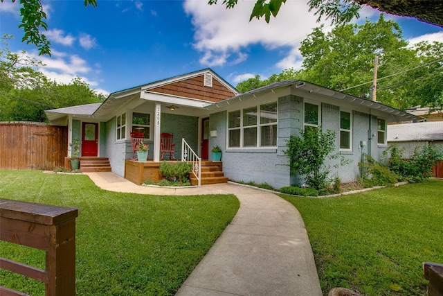 1205 Ranier St, Dallas, TX 75208 - view of front of property with a porch, a gate, and brick siding