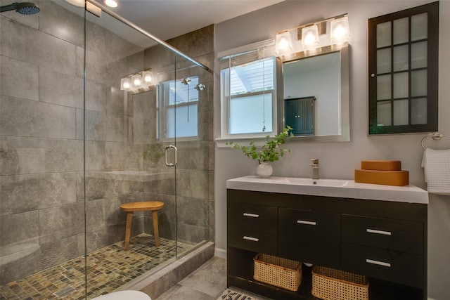 1205 Ranier St, Dallas, TX 75208 - bathroom with a stall shower, vanity, and tile patterned flooring