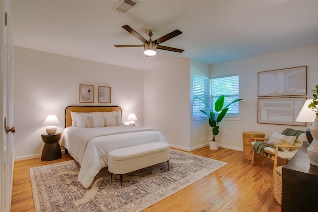 1205 Ranier St, Dallas, TX 75208 - bedroom featuring light wood-type flooring, baseboards, and ceiling fan