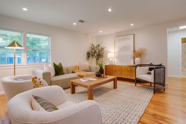 1205 Ranier St, Dallas, TX 75208 - living room with light wood-type flooring, recessed lighting, and baseboards