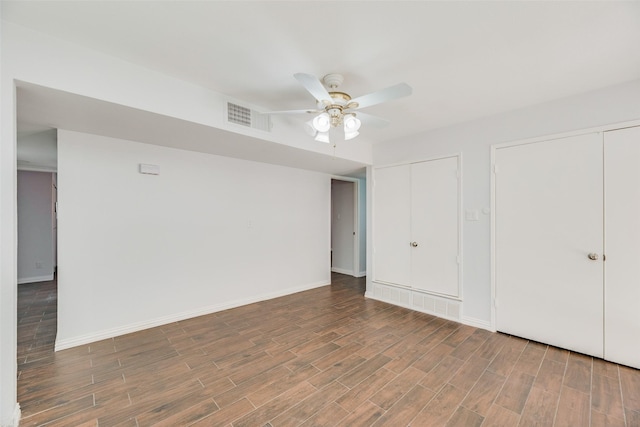 3243 Weather Vane Ln, Dallas, TX 75228 - unfurnished bedroom featuring wood finished floors, multiple closets, baseboards, and a ceiling fan