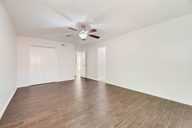 3243 Weather Vane Ln, Dallas, TX 75228 - unfurnished bedroom featuring dark wood-style flooring, baseboards, a closet, and ceiling fan