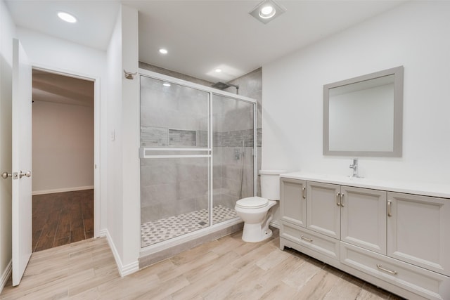 3243 Weather Vane Ln, Dallas, TX 75228 - full bath with a stall shower, vanity, wood finished floors, toilet, and baseboards