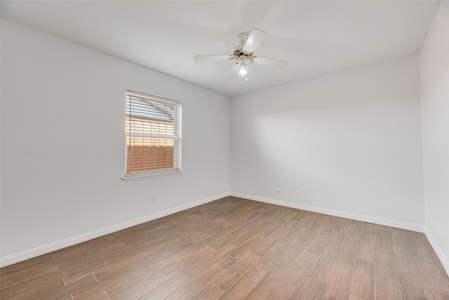 3243 Weather Vane Ln, Dallas, TX 75228 - unfurnished room with wood finished floors, baseboards, and a ceiling fan