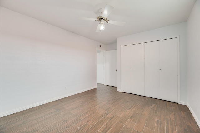 3243 Weather Vane Ln, Dallas, TX 75228 - unfurnished bedroom with wood finished floors, baseboards, a closet, and a ceiling fan