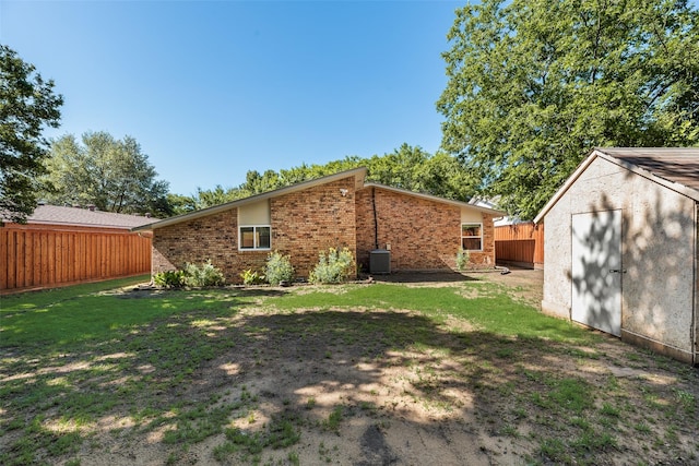 3243 Weather Vane Ln, Dallas, TX 75228 - rear view of house with brick siding and central AC unit