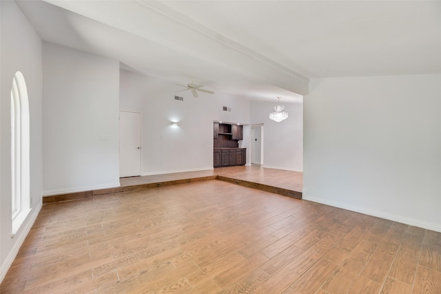 3243 Weather Vane Ln, Dallas, TX 75228 - unfurnished living room featuring light wood-style floors, baseboards, ceiling fan, and a chandelier