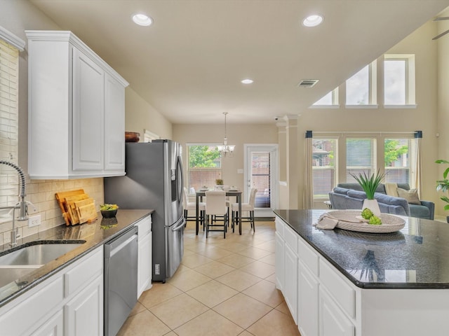 8400 Whistling Duck, Fort Worth, TX 76118 - kitchen with appliances with stainless steel finishes, white cabinets, light tile patterned flooring, recessed lighting, and backsplash