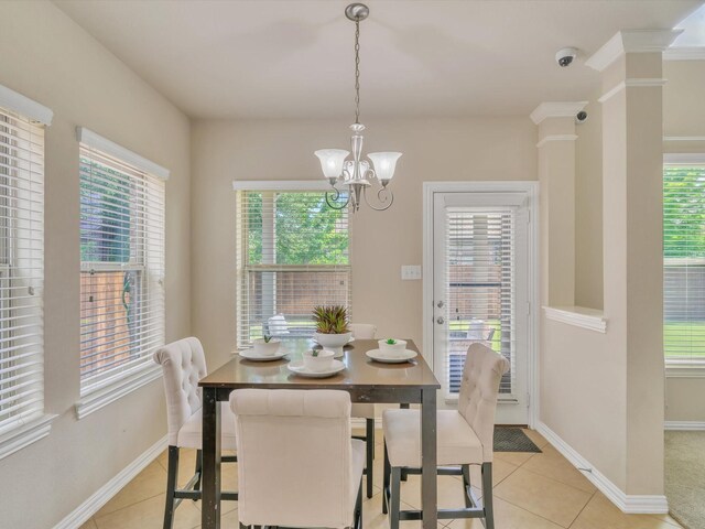 8400 Whistling Duck, Fort Worth, TX 76118 - dining space featuring light tile patterned flooring, healthy amount of natural light, and a chandelier