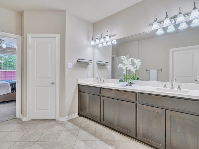 8400 Whistling Duck, Fort Worth, TX 76118 - ensuite bathroom with tile patterned floors, double vanity, baseboards, and a ceiling fan