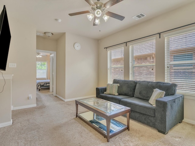8400 Whistling Duck, Fort Worth, TX 76118 - living room featuring a ceiling fan, light colored carpet, and baseboards