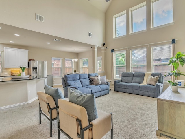 8400 Whistling Duck, Fort Worth, TX 76118 - living area with light carpet, a chandelier, a high ceiling, recessed lighting, and baseboards