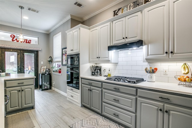 1420 Clearwater Ct, Grapevine, TX 76051 - kitchen featuring gray cabinets, black appliances, under cabinet range hood, light countertops, and decorative backsplash