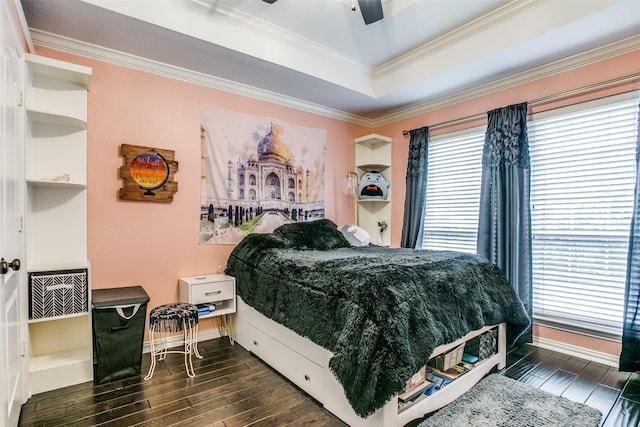 1420 Clearwater Ct, Grapevine, TX 76051 - bedroom with dark wood-type flooring, ornamental molding, baseboards, a raised ceiling, and a ceiling fan