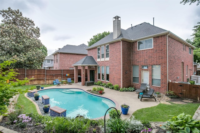 1420 Clearwater Ct, Grapevine, TX 76051 - back of house featuring brick siding, a patio, a chimney, and a fenced backyard