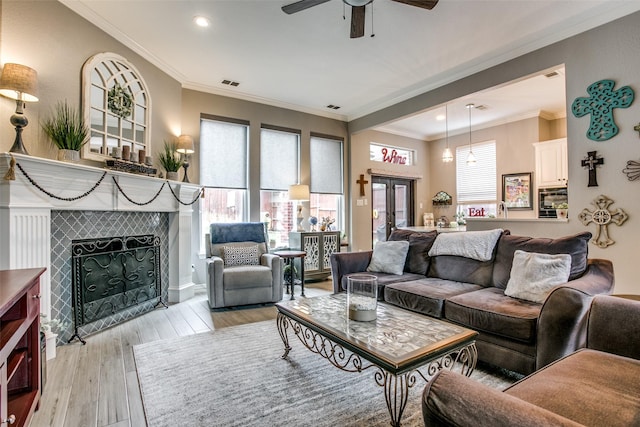 1420 Clearwater Ct, Grapevine, TX 76051 - living area with ceiling fan, a tile fireplace, recessed lighting, light wood finished floors, and crown molding