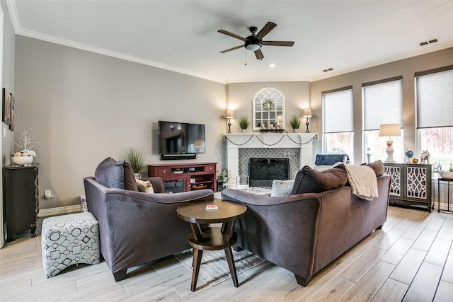 1420 Clearwater Ct, Grapevine, TX 76051 - living area with a ceiling fan, crown molding, light wood-style floors, a tile fireplace, and recessed lighting