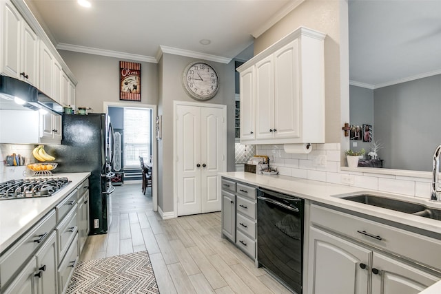 1420 Clearwater Ct, Grapevine, TX 76051 - kitchen with dishwasher, ornamental molding, stainless steel gas stovetop, a sink, and decorative backsplash