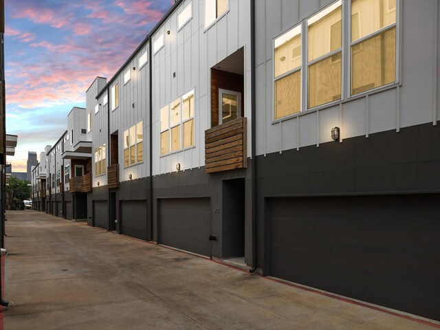 1510 N Washington Ave Unit 503, Dallas, TX 75204 - view of side of property featuring board and batten siding and a garage