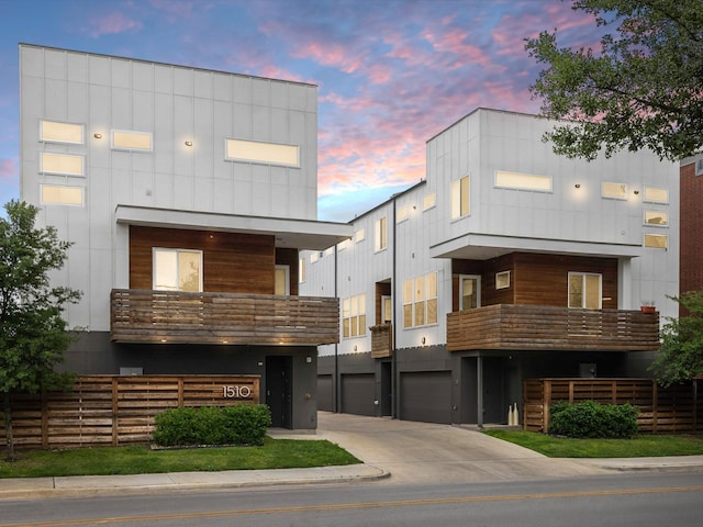 1510 N Washington Ave Unit 503, Dallas, TX 75204 - modern home featuring concrete driveway, a garage, and a balcony