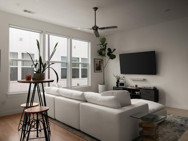 1510 N Washington Ave Unit 503, Dallas, TX 75204 - living area with a ceiling fan, light wood-style floors, and baseboards