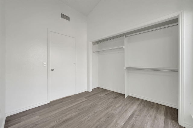 2718 Laurel Oaks Dr, Garland, TX 75044 - unfurnished bedroom with wood finished floors, a closet, and baseboards