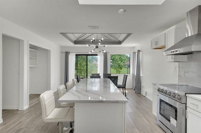2718 Laurel Oaks Dr, Garland, TX 75044 - dining space with a chandelier, light wood-style floors, baseboards, recessed lighting, and a raised ceiling