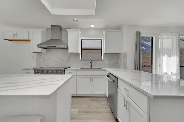 2718 Laurel Oaks Dr, Garland, TX 75044 - kitchen featuring wall chimney range hood, a sink, dishwasher, recessed lighting, and plenty of natural light