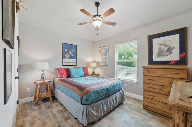 2607 Austin Dr, Granbury, TX 76048 - bedroom featuring light wood-style flooring, baseboards, and ceiling fan