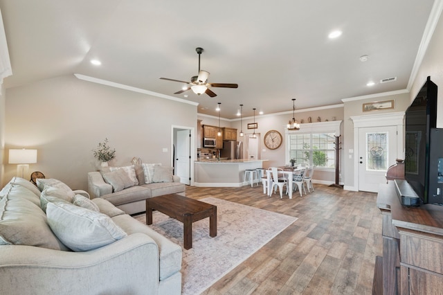 2607 Austin Dr, Granbury, TX 76048 - living room with a ceiling fan, recessed lighting, light wood-style floors, baseboards, and ornamental molding
