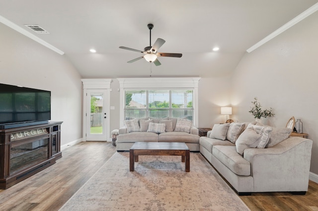 2607 Austin Dr, Granbury, TX 76048 - living area with vaulted ceiling, crown molding, a ceiling fan, wood finished floors, and baseboards